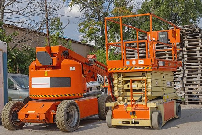 forklift transporting goods in a busy warehouse setting in Arlington, TN